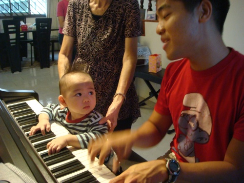 Matthew and Ian playing the piano